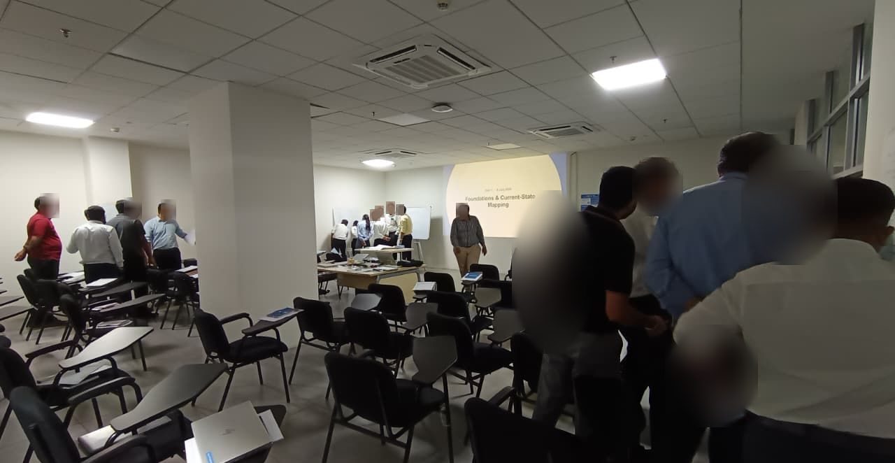 Participants regrouping between value stream mapping exercises