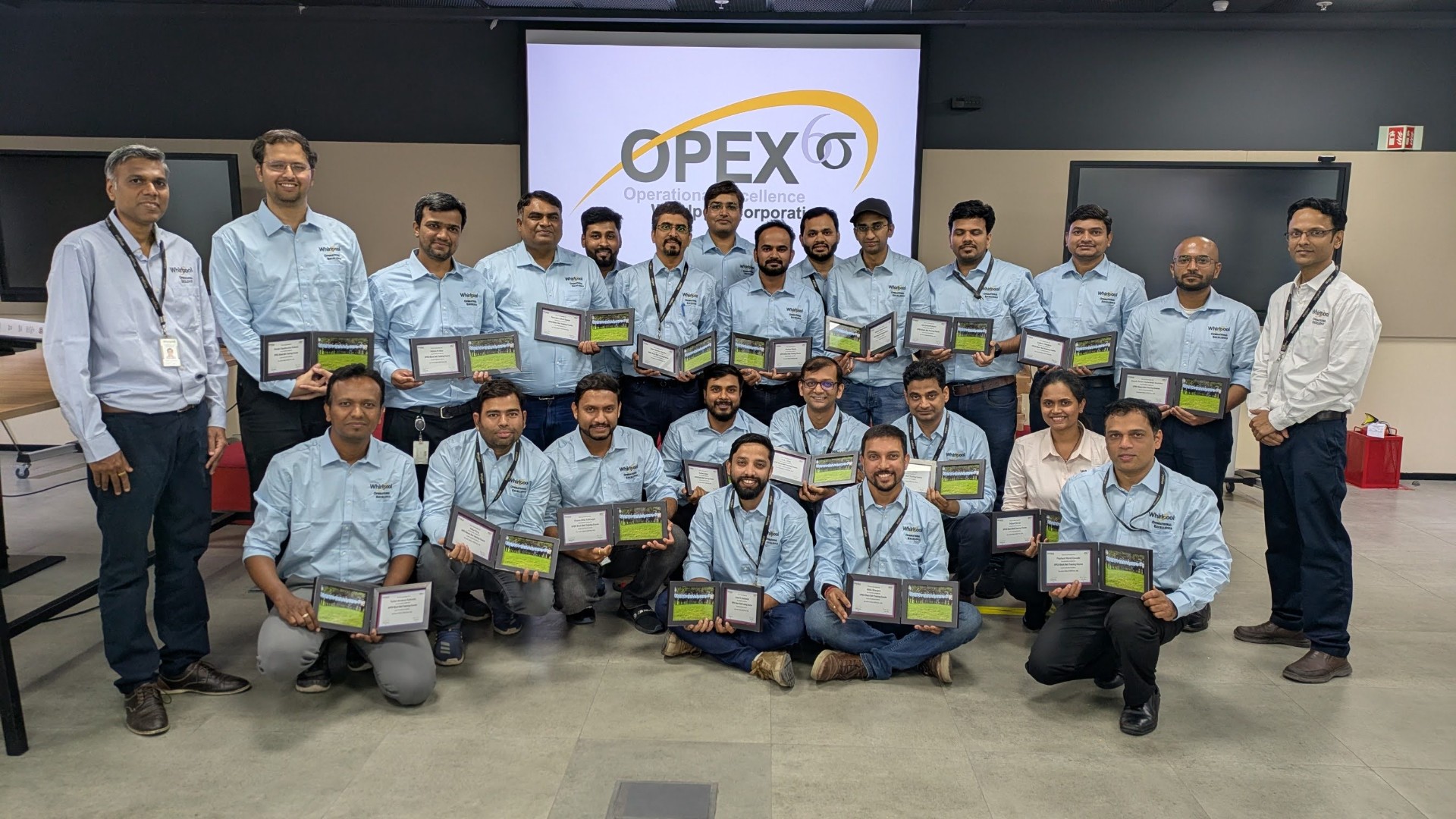 OPEX Six Sigma certification cohort with awards